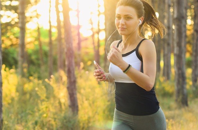 Fitness Girl Running In Garden