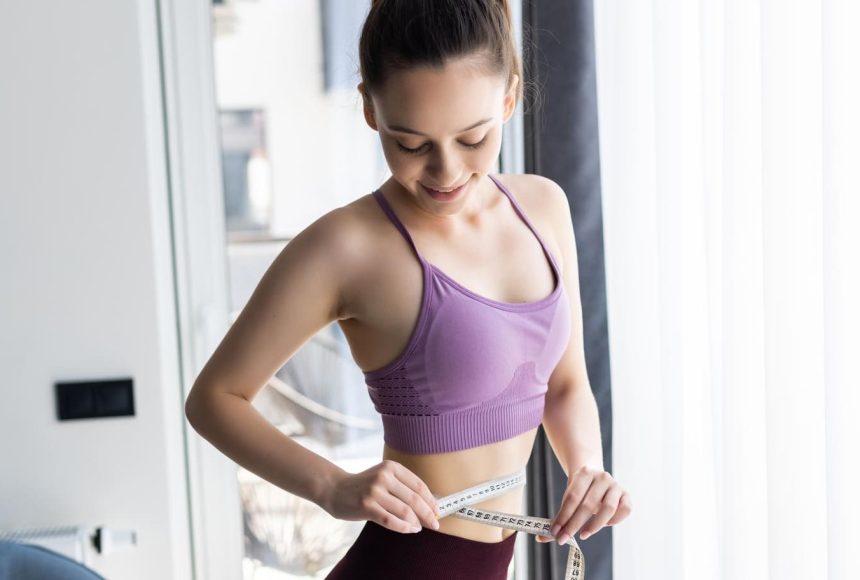 sporty-young-woman-measure-around-her-body