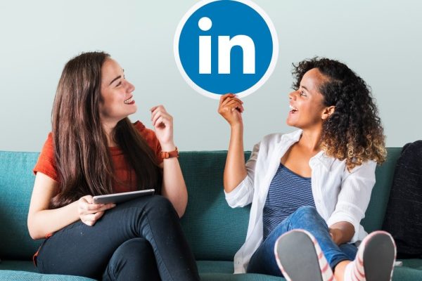 linkedin marketing women holding linkedin logo