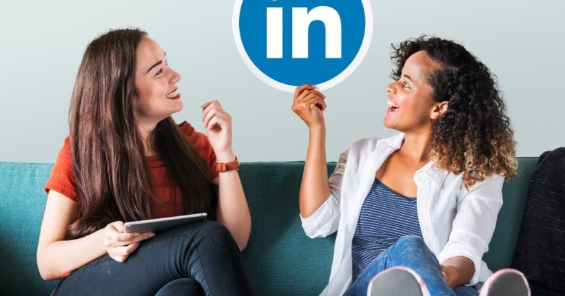linkedin marketing women holding linkedin logo