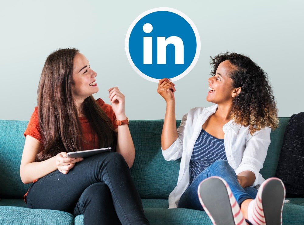 linkedin marketing women holding linkedin logo